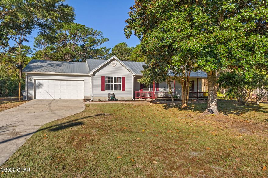 Don't Miss Out On This Adorable 3BR | 2BA Home In East Navarre That's Situated On A Half Acre Lot With No HOA! This Split Floor Plan Offers A Spacious Living Area With Vaulted Ceilings That Is Perfect For Entertaining As Well As The Large Backyard With Screened In Porch! Not To Worry...All Of The Big Ticket Items Have Been Recently Replaced: New Roof (March 2022), HVAC (2019) & Tankless Water Heater (2020). This Home Has Been Freshly Painted Inside & Out. Inside You'll Find Hardwood Flooring In The Living, Dining & Hallway, New LVP Flooring In All Bedrooms, & Tile In Both Bathrooms & Kitchen, Galley Kitchen Equipped With Stainless Steel Appliances & Much More! Home Is Conveniently Located Just Minutes Away From Nearby Shopping, Hurlburt Field Air Force Base & Navarre Beach! Call Today!