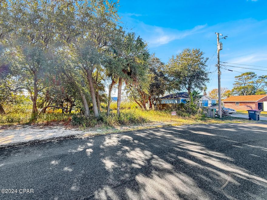 Beautiful lake front lot that is almost 1/4 of an acre! Ready for your newly built home! On the highly desirable West end of Panama City Beach just a short walk to Beach Access # 86. 

All measurements are approx, and should be verified by buyer!