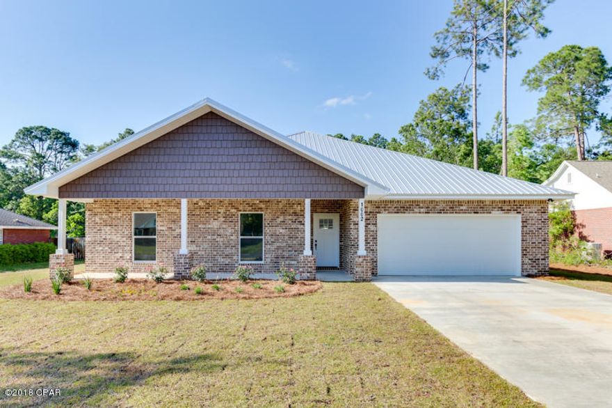 The only new construction home available in the very popular Candlewick/Northshore area! This ALL BRICK, WATERFRONT HOME is amazing and an absolute must see. If you're looking for a custom home feel in one of the best area's in Bay County than you've find it right here at 1002 Kristanna Dr. This 4 bedroom, 2.5 bath is an awesome floorplan and has upgrades throughout that are top of the line! The 25x22 living area features 2 large windows and a set of french doors overlooking the gigantic backyard. There's plenty of room for the kids, a pool, barbecues with the family, and so much more. Back inside you'll love the high ceilings and natural lighting in each room that make your new home feel larger than life. The builder spared no expense in making sure this place had it all. Everything from custom cabinets, stainless appliances, wood-look tile in EVERY room, high-end lighting, glass backsplash, customer master shower and many more upgrades that'll have you ready to pack your bags and call this your new home. If you want more information on the upgrades, locations to some of the best schools in our county or set a private showing with one of our great buyer specialist call us today!!