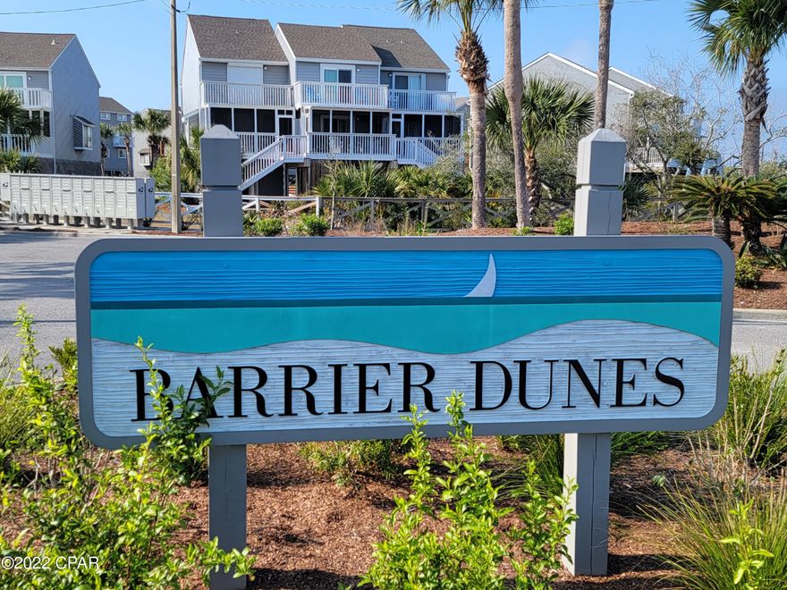 Charming 2BR/2BA townhome located in the heart of the Barrier Dunes gated Community at Cape San Blas steps away from the pool, playground, beach and tennis courts.  Well maintained, furnished, home with recent painting and updated LVP flooring. The living area, located on the second level, is spacious and opens onto a wide deck with a lovely view of palm trees and walking area.. The dining area is located between the kitchen and living area. The second level has the secondary bedroom with access to a full bathroom and private balcony. The primary bedroom is located on the third level with a private full bath, laundry area and open deck.  There are two ac units, covered parking, extra storage and outdoor shower.  This home would make a great home, vacation rental or 2nd home.