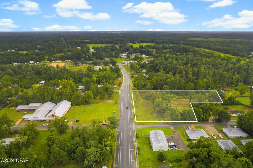 Seize the incredible opportunity to own 3.56 acres of prime commercial property located on Highway 71. This spectacular parcel, nestled on a massive corner lot, has been meticulously cleared for development, offering a serene landscape adorned with mature oak trees. Situated on Highway 71, this property boasts 397 ft. of commercial frontage, ideal for high-visibility businesses. Public sewer, water, electric, and gas are readily available, simplifying the development process. This property is perfect for constructing a gas station, restaurant, or local youth center. There is also a potential to develop multiple residential units.  This property is less than a mile from Lake Alice and Lake Julia, and within walking distance to Family Dollar and Rich's Supermarket. A short drive south on Highway 71 brings you to Port St. Joe. A survey is available, providing detailed insights into the property's layout and boundaries. This property presents endless possibilities for commercial or residential development. Schedule your private viewing today and turn your vision into reality on this prime piece of land.
