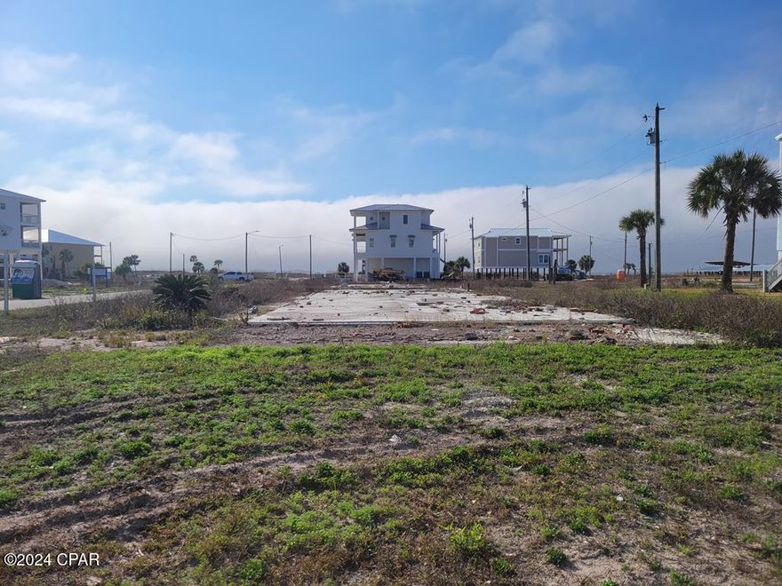 Extra large lot for your dream home AND pool! This corner lot has views of the Mexico Beach canal and is only a short walk to the sugar sands of the beach. Tap fees paid for! Seller Financing available!