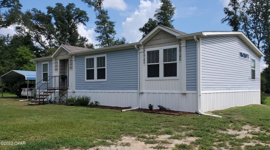 Beautiful 3/2 2019 Clayton Home on 9.88 Acres!   This home looks almost new!  1664 Sq Ft of country charm with almost 10 Acres!  This large Master Bedroom has a beautiful Master Bath with a Double Vanity, Garden Tub and an extra large tile walk in shower.  Enjoy your evening on the beautiful covered deck and watch the deer and other wild life.  This home has lots of privacy but more land can be cleared for your horses or garden.   Animals are allowed.  No Restrictions. Check out all this home offers.