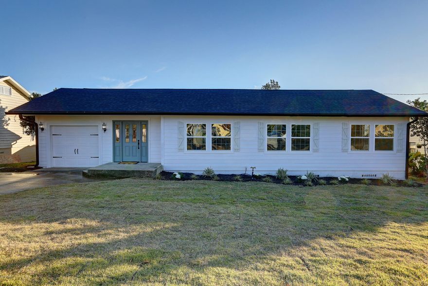 CURRENTLY UNDER CONTRACT, SELLER ACCEPTING BACKUP OFFERS

Cozy Cove Bungalow for under $200,000! This home was completely gutted to the studs and renovated. Upon entering you'll notice the unique exposed brick archway and luxury vinyl flooring. The kitchen is stunning with its Calcutta countertops, shaker style cabinets and stainless steel appliances. The large bathroom is just as clean and updated. Not only is the inside upgraded but this house features an all new roof, A/C, windows, hardie board siding and gutters. Home sits on large lot and  is within walking distance of the water!

All sizes are approximate and should be verified.