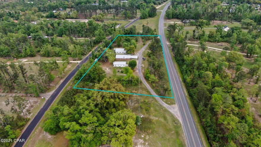 Great Investment! Income producing property on 2.25 acres East of Sneads Florida.Minutes from Lake Seminole.  Includes Brick 3/2 home, one duplex unit with 2/1 each, one 3/1 unit and one 1/1 unit. Each unit has own electric meter, new roof, new central H/A, new paint. Two wells and commercial septic system. Property manager has determined appropriate rent for each unit after new updates. Call for appointment to see!