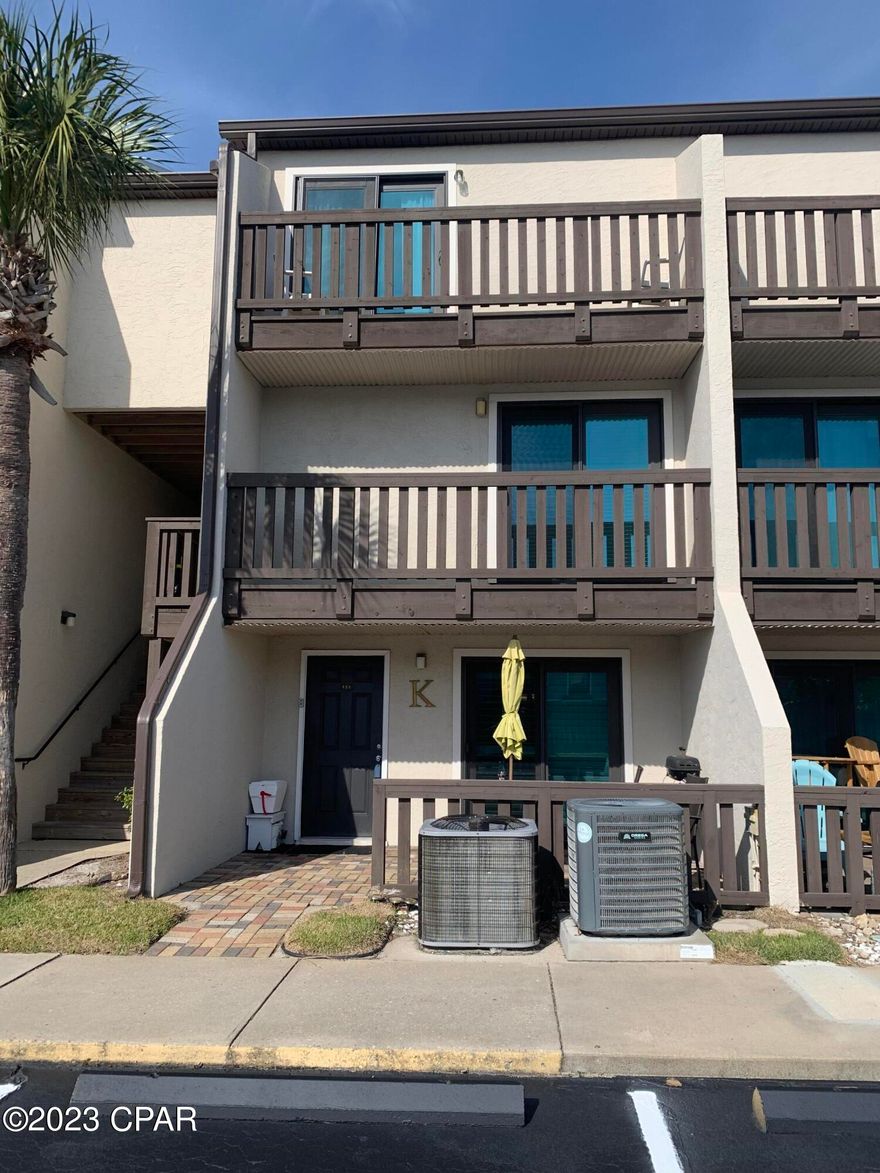 CURRENTLY UNDER CONTRACT, SELLER WILL CONSIDER BACKUP OFFERS 

Beautiful townhouse in a VERY desirable, beachfront complex. Forget crowded elevators and parking lots - park your car directly in front of your unit - unload - and within minutes you are walking on one of the most beautiful beaches in the World! This spacious 2 bedroom, 2.5 bath unit is in pristine condition - very clean, well equipped, ready for immediate occupancy and enjoyment. The main level is bright and cheery, with the living room, dining area, and kitchen all looking out at the courtyard, pool, hot tub, and shuffleboard court. 6 sliding doors have been replaced with hurricane impact-resistant glass doors. Patio Patios on the front and back of the unit are perfect for grilling, entertaining, or relaxing in the sun. Two large bedrooms on the second and third floors are private, with their own bathrooms and balconies. Subdivision amenities include a large beachfront deck, sparkling pool, hot tub, shuffleboard court, meeting room, and gated entry. This is a rare opportunity to own a beautiful, spacious unit in a community located directly on Panama City Beach. Long and short-term rentals are allowed. Largo Mar is very unique and family-oriented, with friendly owners, effective management, and many recent improvements.
