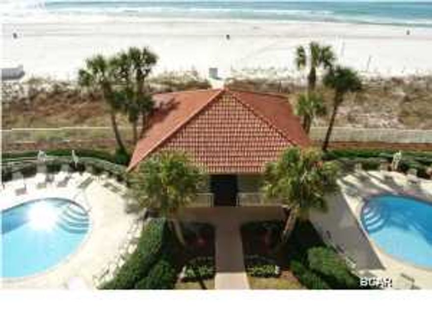 Owners at Coral Reef simply love the place! Nice and quiet with only 14 stories, this 2 bedroom-2 bath unit has large bedrooms and a big kitchen with a grand total of 1568 square feet. (The total includes the 141 square foot balcony that is great for watching the awesome sunsets.) Well maintained, you will find an exercise room on site, a gorgeous view of the sugar sands and emerald waters, a large parking lot, 2 swimming pools - (one is heated), a covered drive-through entrance for unloading on a rainy day, and a beautifully ''coastal chic'' and rental ready condo. This unit has sprinklers, 9 foot ceilings, and an unbelievable view from your bedroom, your living room, your balcony and even your kitchen and breakfast bar areas. When you buy this one, watch out for the friends to ring