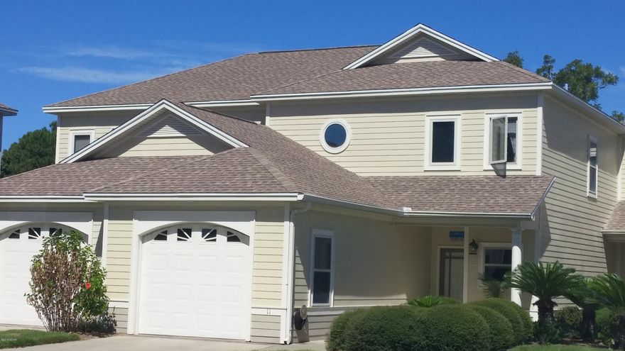 PRICE REDUCED! This immaculate and beautiful townhome located in the desirable Oaks Plantation is turnkey ready! Owners spared no expense in upgrades which include a new Samsung SS ''Showcase'' Refrigerator, a new LG High Efficiency Top Load Washer and a new LG Sensor Dry High Efficiency Dryer.  Also new paint, new carpet, ceiling fans, Kohler faucets, bathroom accessories, Decora light switches and many more. (AC replaced 2010, Water Heater 2015) The foyer has a beautiful archway entrance with oak flooring that leads to the kitchen and an open dining room/great room. The kitchen has top of the line cabinetry with under counter lighting, a tiled back splash and hard surface counter tops. The ground level Master bedroom has a sitting/office area which leads out to the screened in patio. The Master bath has double sinks, tiled shower, whirlpool tub and his/her closets. The laundry room has great cabinet storage and a sink. There is also a half bath on the first floor.  Master bath has double sinks, tiled shower, whirlpool tub and his/her closets. The laundry room has great cabinet storage and a sink. There is also a half bath and both are conveniently located on the first floor. Upstairs there are two additional nice size bedrooms, a large open den/office area and a full bath. Both the master bedroom and great room lead out to a beautiful large screened in patio so you can have your morning coffee or enjoy scenic views of bird life and private Hentz Lake.  This location is centrally located and close to restaurants, shopping, grocery stores and only minutes from the Panama City Beach!