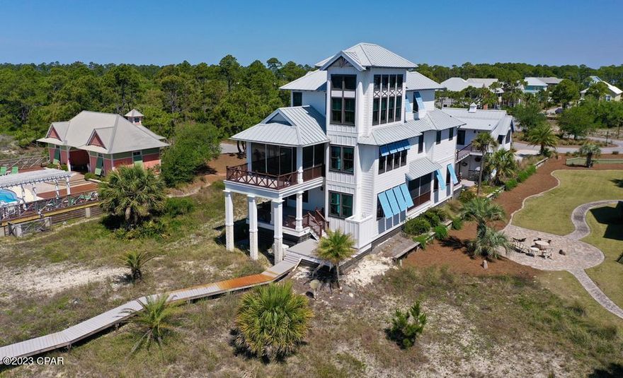 Exquisite Gulf Front showplace with Main House &  Carriage House to provide 5 bedrooms, 5.5 baths in 4800+ square feet of indoor space. Owners selected the most spectacular high end furnishings to create a luxurious Gulf Front retreat with impressive views of the natural surroundings. Enjoy a deluxe chef's kitchen with the finest appliances. Relax around the firepit or watch for passing ships from the spectacular decks overlooking the water. Each room is unique & deftly appointed to create a vision of relaxed elegance throughout the home. You will appreciate the nod to luxury & superlative comfort for you & your guests. Exterior doors & Weather Shield windows  turtle glass. Azek rails & decks surround the house. Elevator access to all floors. The gated community has a high-caliber reputation & you will love the beautiful wide beaches. Close to the pool. Call soon to reserve your place in our sunny paradise!
