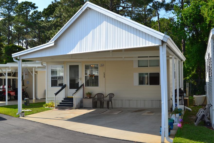 This recetly updated Unit is Ready for new owners. Situated in the Highly sough after Emerald Pointe Resort. It has newer paint, new light fixtures, Open Concept Kitchen new flooring, and back deck this one is a must see. It is a true 2/2, washer and dryer,  backs up to the wooded side of the complex which gives you some private enjoyment on the new back deck. Second lot at the end of the cul-de-sac! Emerald Pointe Resort has a private fish-stocked lake in the center of the community. This is a catch and release fish only lake. There's a boardwalk surrounding the private lake. The Resort features gated security and an impressive clubhouse which has big screen television, pool table, a full kitchen, and rest rooms. Pool and Hot tub.