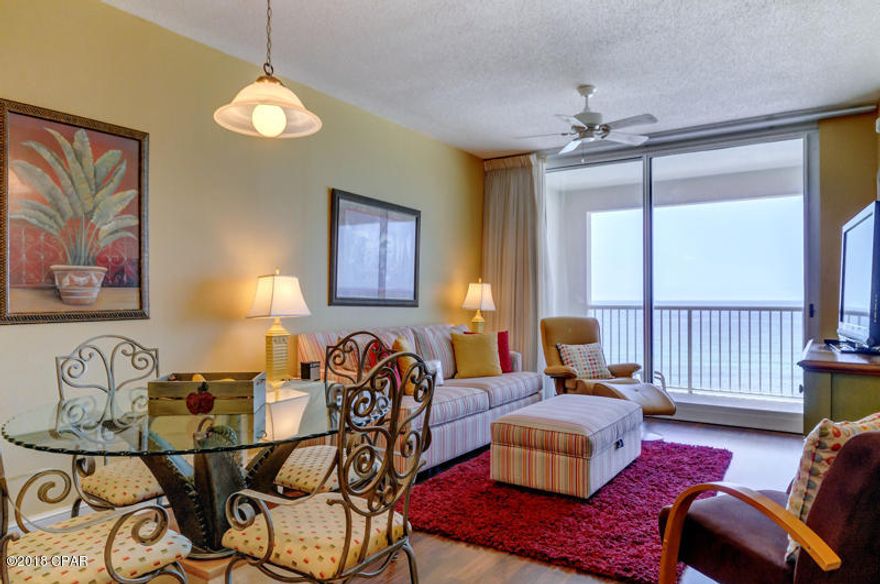 BEST OF THE BEST IN MAJESTIC! PERFECT ELEVATION WITHIN THE STACK!! This one of a kind property conjures up images of sun-splashed days of swimming, biking, and relaxing. It lives like a beach house but comes with all the benefits of owning a condo. This property has been meticulously maintained: New HVAC in 2017, new hot water heater 2018! Hard surface flooring throughout and conveys with luxurious furnishings, window treatments, and artwork that welcome you to lie back, relax, and enjoy panoramic views of the pool, beach and ocean. Condo has 9'. Open floorplan and 9' ceilings allow for fabulous Gulf and sunset views from balcony, living room, dining room, kitchen, & master suite providing the ultimate alfresco living and entertaining environment! Sunset views from the generous, private, balcony are a perfect end to a sunny day and beginning to an exciting evening. MAIN MASTER SUITE is front and center on the beach with direct access to the main balcony and private bath complete with garden tub, separate shower, and large walk-in closet. The master suite opens from a glass slider door to a covered balcony. LUXURY! COMFORT! CONVENIENCE! Can be configured to sleep up to 10 people! EXCELLENT RENTAL INCOME POTENTIAL. Enjoy the good life at Majestic Beach with an unparalleled deck of resort style amenities including: 650 linear feet of sugar white GULF FRONTAGE, Four Large outdoor pools (2 at Tower I and 2 at Tower II), Two Indoor heated pools (one in Tower I and one in Tower II), Two hot tubs, Baby pool, Wading pool with waterfall, H20 Bar and Grill serving Gulfside/Poolside lunch and dinner, Large outdoor dining area, State of the Art Fitness center with steam room and sauna, 130 seat Stadium seating Movie Theatre, Convention center, Private Owner's Lounge with full Kitchen, Tennis Courts, Majestic Market featuring Starbucks coffee. Quick distance to the the wonderful shopping, dining and entertainment at Pier Park. FROM THIS CONDO, YOU ARE WITHIN STEPS OF EVERYTHING YOU COULD EVER WANT AT THE BEACH!