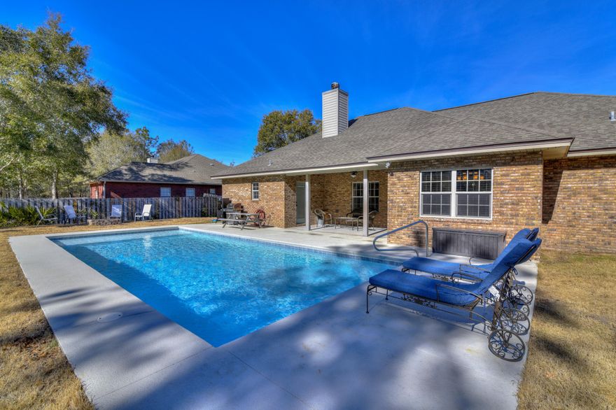 Impeccable custom built, all brick, 4 bed/3bath residence on fenced in half acre and NEW saltwater inground pool in the quiet Cedar Creek Chase subdivision. Split floor plan with 2 suites, crown molding, recess lighting, tray ceilings, corner fireplace in the living room, large dining room plus all the must haves in the kitchen, featuring all custom made maple wood cabinets, built in desk, Corian countertops and stainless steel Maytag appliances. New carpet in all bedrooms, pergo floors in the living room. Water line, 20 & 30 amp service to accommodate a camper in the backyard. The 16x37 sports pool has Pentair Racer cleaner and booster pump, 3ft deep on the ends and 5ft in the center. All measurements are approximate please verified if important Second suite with an exterior access door to the covered porch, the second bedroom has a built in desk and the third bedroom has a walk-in closet. The hallway bathroom has double vanity.