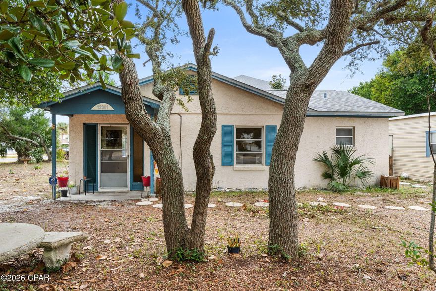 Situated in the heart of Panama City Beach, this property offers a rare blend of investment potential, location, and privacy—all within walking distance from the sugar-white sands of the Gulf of Mexico. Whether you're searching for a primary residence, second home, or income-producing opportunity, this home checks the boxes that matter most.

Set on a large lot shaded by mature trees, the property provides a peaceful, serene setting while still being close to everything PCB has to offer. The expansive yard offers plenty of room to expand, add outdoor living space, or simply enjoy the natural surroundings.

A detached garage adds versatility and value—perfect for storage, a workshop, beach toys, or parking. With 3-bedroom, 2-bathroom home with nearly 1,300 square feet provides plenty of comfortable living space.

Conveniently located near top-rated schools, popular dining, shopping, and entertainment, and just a short drive or bike ride to the beach, this home offers everyday convenience paired with coastal lifestyle appeal. Its proximity to major attractions and the Gulf makes it especially attractive for a primary or rental.