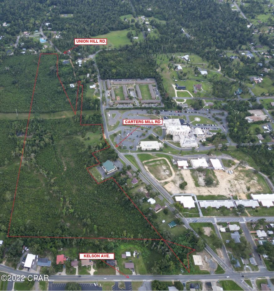 Prime Development Property! Approximately 27 acres in downtown Marianna. This property is located directly across from Jackson Hospital and other doctor's offices. Zoned Mixed Use, making it ideal for residential development.  The property has natural growth on it right now. Access on Carters Mill Road.  Adjoining properties available - See MLS #'s 730123,7301327,730124.