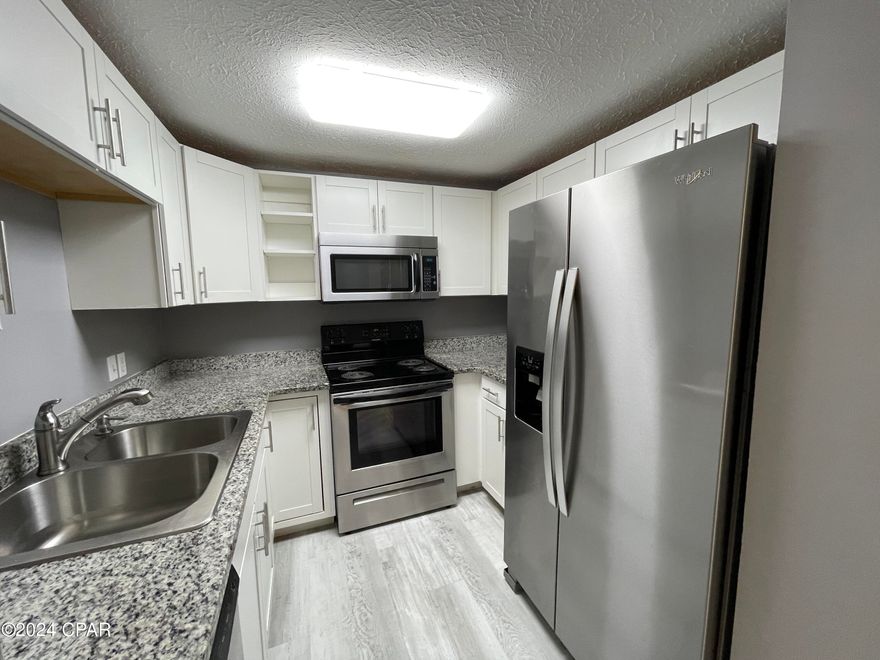 For Lease - Nicely updated 3 BR, 2 BA townhome in Lynn Haven! The townhome was updated with fresh paint, vinyl plank flooring, stainless appliances, and offers a split bedroom floor plan. The master suite is on the back side of the home and has a patio access door and an en suite master bathroom with tub/shower. The two additional bedrooms are on the front side of the home and have a hallway bathroom. Dining room is off the kitchen and has a back patio access door as well. The back patio is great for a grill and dining set with a privacy fenced back yard. *Pets negotiable under 25 pounds with $250 pet deposit and $25 monthly pet rent.