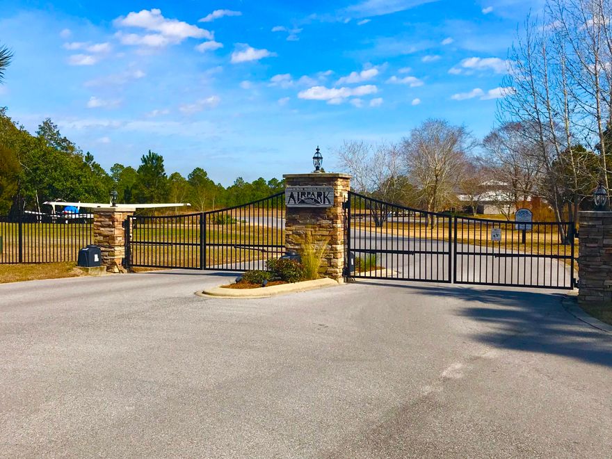RUNWAY LOT in a the gated flying community of Sandy Creek Air Park. This Air Park is home to 100 residential lots with underground utilities, a community center,and a recently paved 3,200 foot runway with lights and a beacon for night flying. This is a .75 acre cleared lot. All interested parties should verify measurements in person if important. The FAA airport designator is 75FL located on the New Orleans sectional chart. Prior to Hurricane Michael this lot had a 30x40 hangar on it. The slab is still in tact ($$$ saver), but the association will not allow it to be re-built unless a home is being built at the same time.