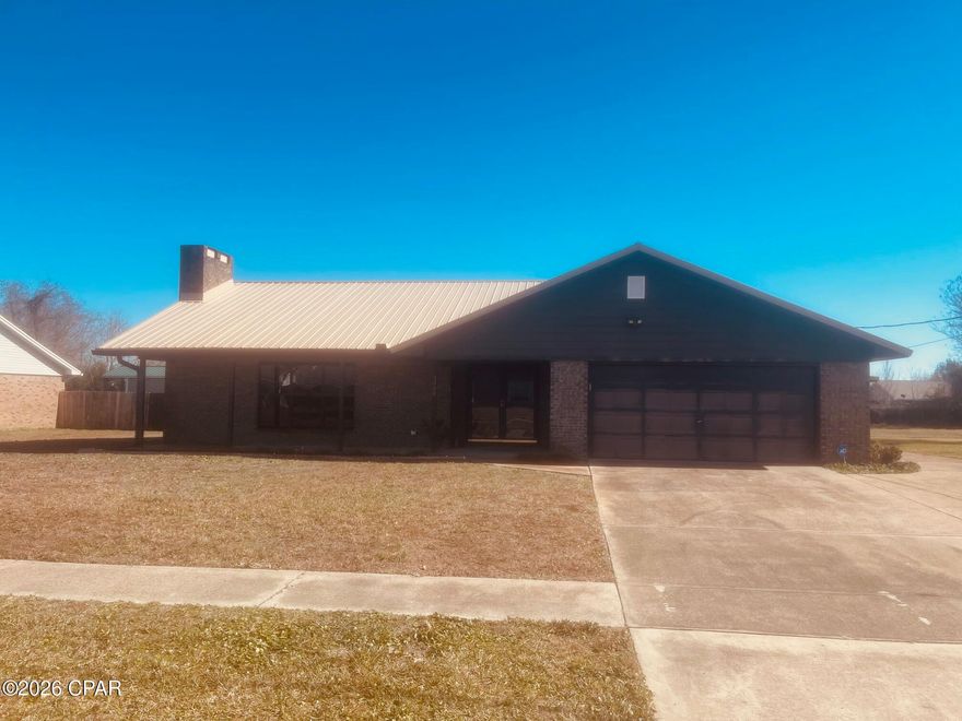Well-built brick home on a large lot in the heart of Panama City. Features a metal roof, large spacious bedrooms, functional layout, cozy fireplace, and excellent storage throughout. Oversized parking for boats or RVs, two-car garage with insulated door and cabinetry, lockable carport, stand-up lighted attic, and fenced pet area. Quiet neighborhood with quick access to shopping, dining, and everyday conveniences.