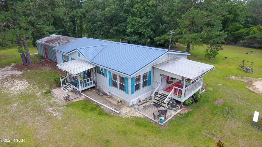 CURRENTLY UNDER CONTRACT, SELLER WILL CONSIDER BACKUP OFFERS

If you've ever dreamed of experiencing peace and tranquility, now's your chance! This charming 3-bedroom, 2-bath mobile home sits on 6 acres in Westville, Florida. Perfect for outdoor enthusiasts, it offers ample space for your very own garden. The current owners even offer to leave the chickens with you! This well-maintained home comes partially furnished, making it move-in ready.