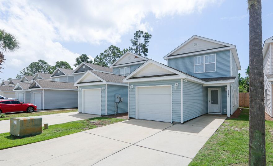 CURRENTLY UNDER CONTRACT SELLER ACCEPTING BACK UP OFFERS. Check out this recently renovated townhome with 1-car garage in the exclusive gated community of The Gates of Sterling Cove. Upgrades include new waterproof laminate flooring in both upstairs bedrooms & also the stairs/landing area, new ceiling fans throughout, some new blinds, and fresh paint throughout the home. Great, open floorplan downstairs with a huge kitchen with plenty of storage. 2 good sized bedrooms, full bathroom, and laundry room are upstairs. The rear upstairs bedroom has a private covered balcony area to enjoy the outdoors. Sterling Cove is a well maintained gated community with its own pool, trash pick-up and landscaping is included in the low HOA Dues, along with once per year exterior pressure washing.