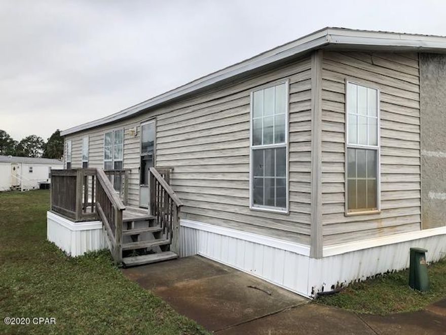 FLIP OPPORTUNITY or make this your  personal fixer upper.  This spacious 3 bed, 2ath double wide mobile home is ready for your personal design  touch!  Located in the lovely Greenwood Acres, a 55+ retirement community. It is conveniently located between Panama City Beach Parkway and Front Beach Road on Panama City Beach. Close to shopping, restaurants and just minutes from the  beaches.

All sizes are approximate, buyer measure if important.