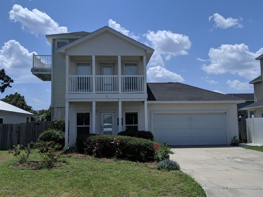 'CURRENTLY UNDER CONTRACT, SELLER ACCEPTING BACKUP OFFERS Unique three story beach home in popular Open Sands subdivision. Large top floor loft with South facing balcony would make a great entertaining space, office, or private escape! Second floor features three bedrooms, two full baths, and a balcony off of the master suite. First floor has an open floorplan for the Living room Dining area and kitchen area with stainless steel appliances, full bath, and guest bedroom with French doors. Home is being sold AS IS