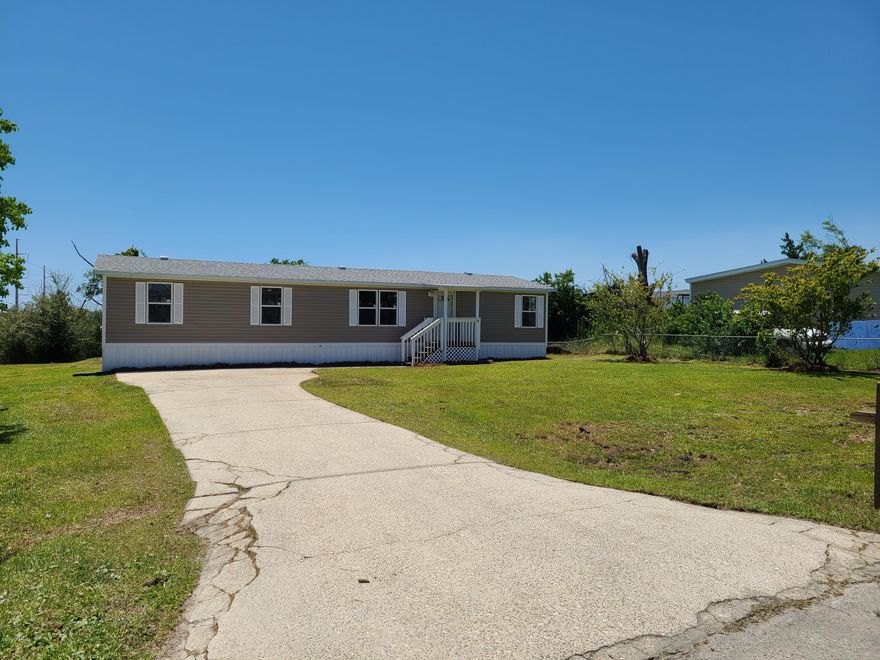 THIS PROPERTY IS CURRENTLY UNDER CONTRACT BUT THE SELLERS ARE TAKING BACKUP OFFERS. This is a very nice freshly remodeled home with brand new cabinets, flooring, windows, doors, trim, Wainscoting, sink, bathroom vanities, roof,  along with a very nice front and back yard with a 10x8 deck out back great for grilling or just relaxing, located in the very quiet laid back neighborhood of Sweetwater Village this would make a great starter home or investment rental for great side income.