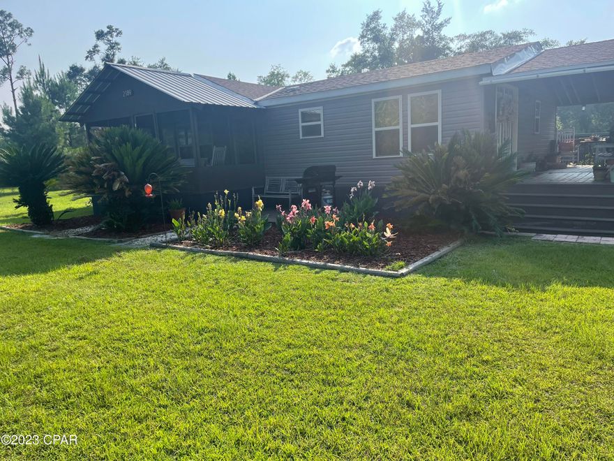 Country living at its best! This 3/2 home has recently been renovated.  The kitchen has new cabinets, new countertops, backsplash and stove hood.  Vinyl plank floors and new carpet throughout the home.  The roof is 4 years old & new well pump in 2021. The porches are large and beautiful!  Curb appeal with nice landscaping, access to the pond for fishing, chicken coops, 2 sheds and one has a bathroom and A/C unit and an outdoor kitchen area.  There is a great fire pit and so much room for your gardening and animals.  Conveniently located to I-10, Panama City Beach, Tallahassee and Dothan, AL. Make an appointment today to see this beauty!