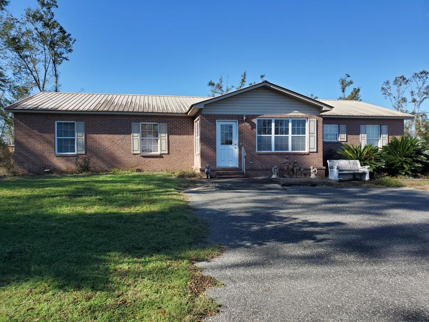 Perfect for a large family or for Mother-In-Law Suite!  There is so much space in this 5 Bedroom 3 Bath home!  This would also make a great Group Home or Foster Home!  There is so much that this home has to offer.  2 Separate Heat/Air Units.  Large Living Area.  Enclosed Sun Room with tile floors.  Enclosed front porch. 

Double Garage,  Large Covered Patio / Picnic Area!  Private Well and Septic.  Located between Panama City and Marianna.
