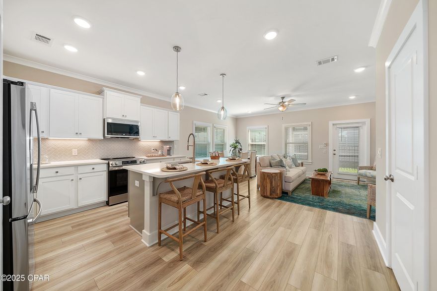 Our stunning pool is NOW OPEN! The prefect place to SOAK UP THAT Florida SUN! Seagate at Clara is a new townhome community nestled in the vibrant city of Panama City Beach, FL. This two-story unit features board and batten exterior and covered entries. One car garage provides a great space for storing beach essentials. This Unit has a LARGE FENCED IN PRIVATE YARD.  This open concept townhome boasts a stylish kitchen with white cabinets, tile backsplash, a large island with quartz counter tops - perfect for entertaining.  The elegant Owners Suite is designed with comfort in mind showcasing a large walk in closet and double- bowl vanities. Main Bath has tiled shower.  All bathrooms have quartz countertops.  LVP is located throughout the home.  The community pool features a cabana, lounging, seating and grilling stations. This community has a dedicated dog park. Seagate at Clara is in a prime location, approximately 1.4 miles to the sandy beaches and just minutes from Pier Park.