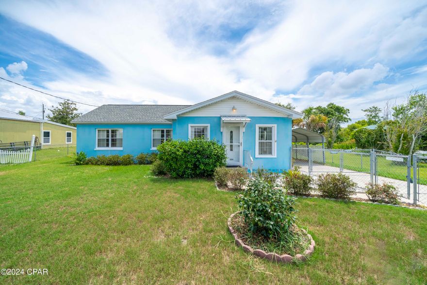 Welcome Home!  This adorable Cove home sits on just over a quarter acre of manicured land with a fully fenced in yard in a quiet neighborhood.  As you walk into the home, you enter the front living room with plenty of windows to let in the natural light and you will notice the home has tongue and groove pine walls throughout.  As you continue through, the next room is your spacious formal living room with a propane fireplace.  The kitchen and dining room are towards the rear of the home and offer plenty of space for entertaining.  The kitchen has granite countertops and custom cypress cabinets.  Down the hallway you will find the 3 bedrooms, bathroom and laundry loom.  The laundry room has built in cabinets, a stand up freezer and a full size standard sink.  The bathroom has been updated with a new vanity and a Kohler walk in tub that has a lifetime warranty.  This home has had many updates including a new roof, insulation and ceilings in 2018.  The laundry room could possibly be partially converted to an additional bathroom.  All plumbing in the home and to the street has been replaced with pex piping and the AC is less than 10 years old.  The back yard has a workshop with additional storage area and electricity.  There are also 2 lean to's on each side of the workshop that you can park a vehicle under.  There is plenty of room in the backyard for an RV, boat or you could add a pool.