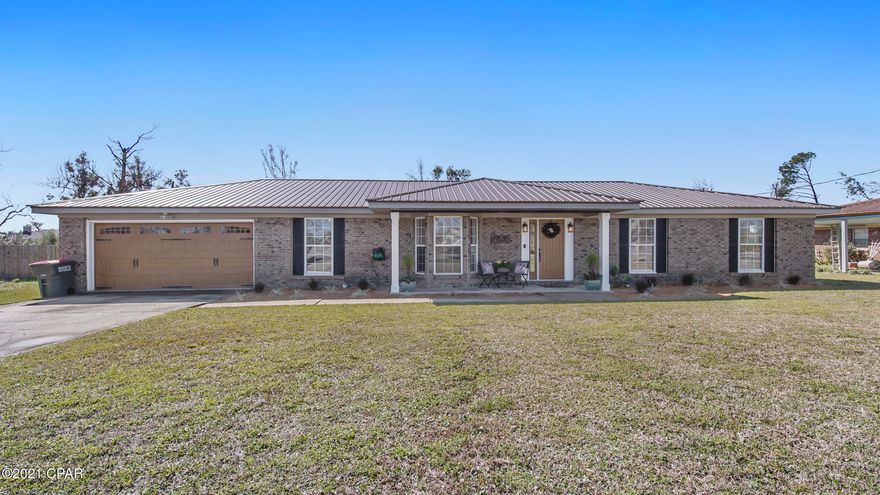 THIS IS THE ONE  ! Great Location, Stunning Kitchen, HALF ACRE fenced in backyard & additional 20x24 workshop.  What else could you possibly ask for ?? Lynn Haven beauty is a must see! This home has been well cared for by the current owners and it shows. The  designer kitchen with its massive island can seat 4 comfortably. The flow of this home provides an inviting open kitchen & family area with a brick fireplace for that cozy feel. An extra bonus room at the front of the home is shared with the dining space. Don't get me started on the backyard : )  200 ft. deep lot offers a HUGE fully fenced in backyard with plenty of room for whatever you can dream up! 2 car attached garage with extra storage and a long driveway. This home will be seen by many but can only be owned by one...