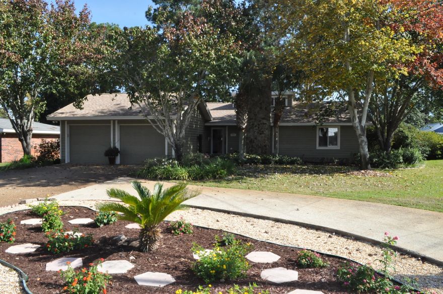 MUST SEE...HOME LOOKS LIKE IT WAS BUILT IN YEAR 2000 OR BETTER! Outstanding Colony Club home on the 2nd fairway of the Holiday Golf Course!  This 3BR/2BA beauty is immaculate and   recent improvements include a new roof in 2014, fresh paint, and a new sprinkler system.  The interior boasts an open floor plan with lots of natural light and you're sure to love the expansive Sun Room with panoramic views of the golf course and gorgeous backyard.  The Kitchen has Corian counter tops and new stainless appliances.  Additional features include hardwood floors, crown molding, a wood burning fireplace, lots of closet space and split bedrooms.  Parking is a snap thanks to a two bay garage and an oversized circular driveway. Tons of curb appeal front and back with many flowering bushes and trees and even a very healthy lemon tree!  There is a brick paved patharound the backyard and the yard looks like it belongs among the pages of Better Homes & Gardens!  This exceptional home is move-in ready and you can't beat the location.  All info is approx. and must be verified by Buyers if important.