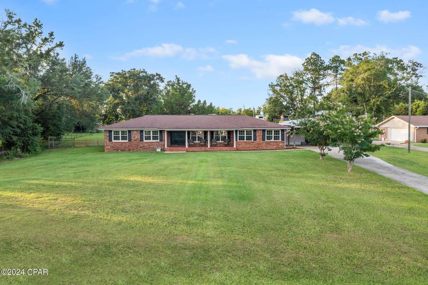 Features of this spacious Ranch home include 3/2 bedrooms, Den, Family Room, Workshop, all on a one-acre lot with hilltop views. Easy access to town, water activities and schools.  Call today to set up your private showing of this well kept home.