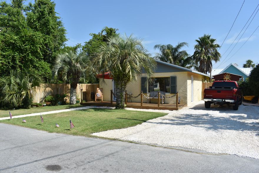 Great Florida Beach Cottage with gated, deeded beach!  If you need a place to live but also want a spacious and comfortable area for your construction or artistic projects, then this is the home for you!  All the while, you will own a part of Panama City Beach's beautiful beach just four blocks away in this golf cart community!  This beach cottage and its separate two-ton air-conditioned, 12' by 24' workshop sit just blocks from the deeded Bid-A-Wee beach belonging to its residents!  The home's concrete block construction has allowed it to withstand the test of time.   This home is move-in ready although you may wish to add your own touches. This cozy cottage features an open living, dining, and kitchen area, two bedrooms and two full bathrooms.  New 2.5 ton 14 seer heat pump condensing unit installed in June 2019!  New R38 insulation in the attic!  But wait until you see the workshop/studio in the fenced yard!  Fully air-conditioned, this is the perfect spot for your artisan or building projects!  Make an appointment to see this home today and start enjoying the Florida beach life!  [Bid-A-Wee owners enjoy private gated-access to their part of the incredible Gulf of Mexico.  Owners may join a voluntary association for $100.00 per year which allows them a vote in subdivision matters and other benefits.]