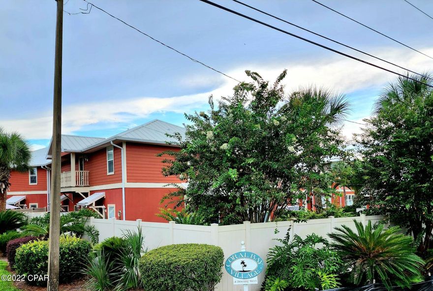 Come and experience Coral Bay Village! This Key West architecture inspired townhome is sure to please! Located on the highly desirable West End, just blocks to the beach, close to 30A, and only a few miles to the infamous Pier Park with tons of shopping and restaurants. The 3 bedroom 2 ½ bath floor plan features high ceilings and a Juliet balcony. The kitchen shines with granite countertops and new stainless-steel appliances.  Newer W/D and HVAC (2020). Don't feel like going to the beach? Relax in the community pool just steps away from your front door or grill and socialize on the beautiful tropical landscaped patios. Coral Bay is a golf cart friendly community. Did I mention with an acceptable offer this unit can even come with a Yamaha gas golf cart that the owner purchased new in 2020