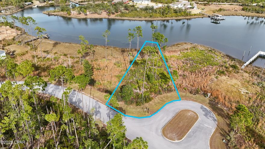 Welcome to Laird Point, where waterfront living meets everyday ease. Tucked along a peaceful natural peninsula off the Intracoastal Waterway, this cleared homesite offers the rare opportunity to build your dream home with year-round deep water access right from your backyard. From your future dock, you can cruise straight from the bayou out to the Gulf, making this an ideal spot for boaters, anglers, and anyone who loves life on the water. The lot is ready to build and showcases beautiful water views, creating the perfect backdrop for morning coffee, sunset dinners, and everything in between. It's easy to picture stepping outside and heading straight to the water; whether for a day of fishing, kayaking, or simply enjoying the calm and quiet. Laird Point is known for its sense of privacy while still offering a strong community feel. Residents enjoy a variety of amenities, including tennis and pickleball courts, a basketball court, boat and RV storage, and scenic walking trails that wind through the neighborhood. It's a place where active living and coastal relaxation go hand in hand. If you've been searching for a waterfront lot that offers both natural beauty and lifestyle convenience, this is a special opportunity to create something truly yours.