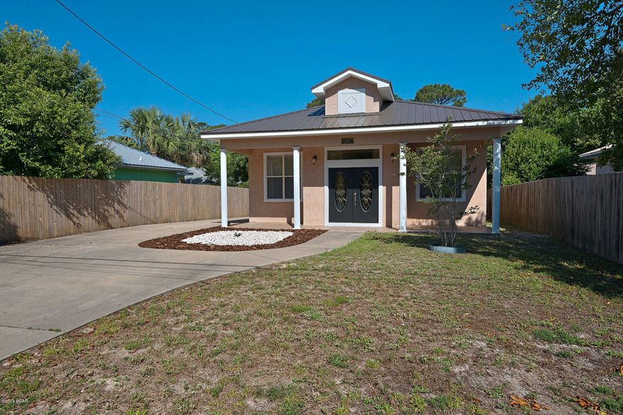 Beautiful home only 1 block to beach, 10' ceilings, open floor plan, new metal roof last year, stucco siding, new AC, huge master suite, big yard 50x 201, privacy fence in back yard, plenty of room for a pool...the list goes on and on. 4 BR/2 Baths, 2, 034 sq ft.