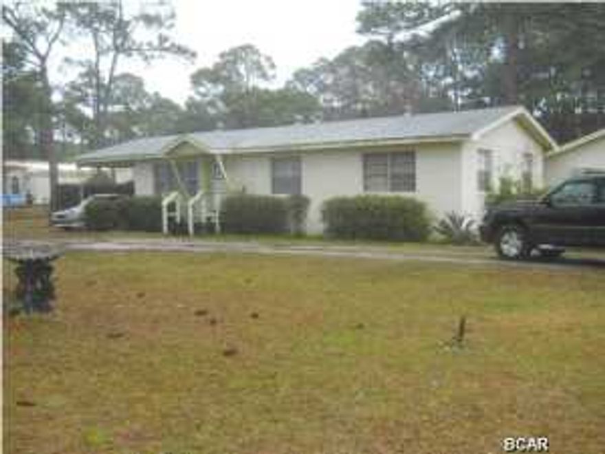 Perfect corner location on Panama City Beach with approx. .7 acres of land zoned C-1 Commercial! Corner parcel at Joan Ave. and Laird St. Very convenient and close to N. Lagoon, Thomas Drive and Front Beach Rd. Property has a residential home with a huge seperate detached workshop. There is a pond in the backyard. Back yard is huge with an entrance on Laird Ave. Fruit trees are also on the property with a small dock to fish from or relax and watch the ducks & turtles. Driveway access on Laird and Joan Ave. Perfect property for future development, office, or business. All information is taken from public records. If important to buyer, please verify.