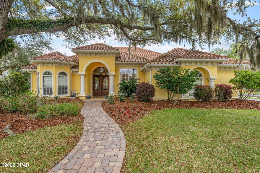 CURRENTLY UNDER CONTRACT, SELLER ACCEPTING BACKUP OFFERS This stunning home was built by Rick Koehnemann, one of Bay County's premier builders and is located in the prestigious Cove Pointe neighborhood. With almost 3000 square feet of living space, this four bedroom, three bath home offers everything you could need or want. As you walk through the eight foot leaded glass doors, you enter a foyer with 12 foot ceilings that is open the dining room and living room . The dining room has custom drapes and the living room has double-tray ceilings and a view straight out to the pool and beautiful back yard. To the left is is the large fourth bedroom with a bay window  and large closet. Towards the back of the home, there is a second living area and that family room is open to the spacious kitchen. If you enjoy entertaining, this kitchen is a chef's dream. There are lots of custom wood cabinets for storage and a huge two-level island with granite counters for additional storage along with a pantry. The built-in microwave and wall oven and gas stovetop are great for those that love to cook and there are two separate bars, great for coffee and a home bar, one with a built-in wine rack.  The family room also features a beautiful tray ceiling and views of the pool as well. The spacious master is a retreat from the world with a door to the pool area and covered patio. There are two huge walk-in closets on the way to the amazing master bath. Double vanities, a whirlpool tub and a walk-thru shower with double shower heads make this bathroom a beautiful and relaxing space. The two additional bedrooms are quite large and share a bathroom. The third bath is accessible from the pool area, always a great idea. The backyard is truly something special with an inground heated salt water pool and spa, lush landscaping, a covered patio and porch and a charming pergola. The patio is plumbed for gas if you would like an outdoor kitchen and the lush landscaping provides both abundant color and privacy. The garage is oversized and there is ample storage throughout the house as well. This quality house feels like home the minute you walk in. Call your Realtor for your personal tour today.