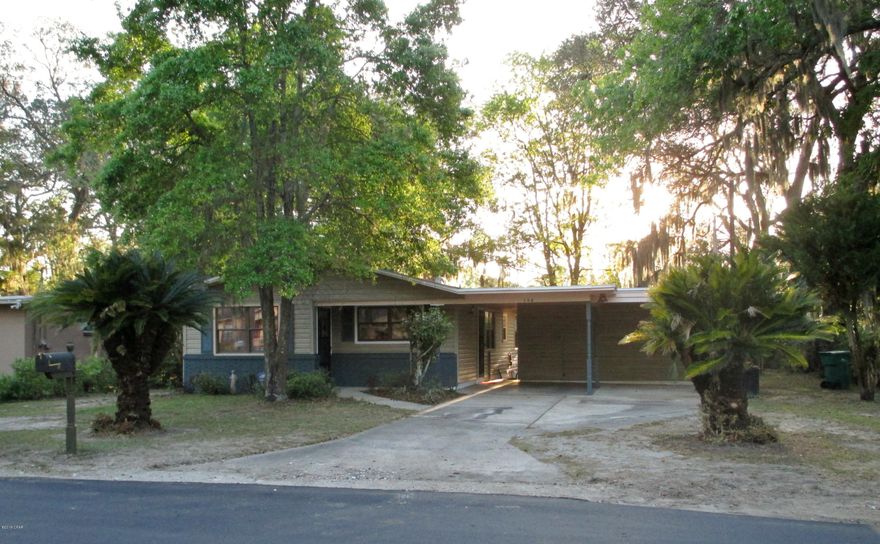 Great fenced corner lot with beautiful mature trees. 3 bedroom, 2 bath home with new roof on main part of house, kitchen cabinets with glass back splash, new stainless steel appliances and new front door and paint, new commodes and sinks. Attached 2-car carport with closed in laundry room/storage at back of carport. Short distance to schools, churches and shopping yet still in quiet neighborhood.