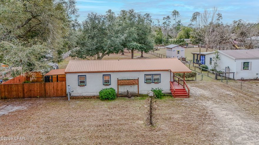 Tucked away on nearly 0.7 acres in Southport, this adorable 2-bedroom, 2-bath mobile home is full of charm and opportunity. With 1,086 square feet of comfortable living space, this home feels cozy without feeling cramped—just the right size for easy, relaxed living.
Inside, you'll find a welcoming living area filled with natural light and a layout that simply makes sense. The kitchen opens nicely to the main living space, making it easy to cook, gather, and unwind. Both bedrooms are well-sized, and the primary bedroom includes its own private bathroom—perfect for a little extra comfort and privacy.
Step outside and you'll immediately appreciate what makes this property so special. The spacious lot offers plenty of room to enjoy the outdoors, whether that means gardening, entertaining, letting pets roam, or just soaking in the peaceful surroundings. It's quiet and tucked away, yet still conveniently close to shopping, schools, and just a short drive to the beaches and everyday conveniences of the Panama City area.
If you're looking for a sweet, affordable home with land, privacy, and tons of potential, this Southport gem is one you won't want to miss.