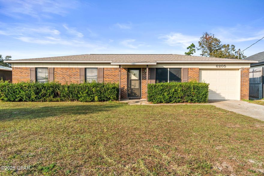 INVESTORS - this one is for you!! Welcome to 6205 Boat Race Rd, a solid brick ranch with good bones, an oversized backyard, and endless potential. Whether you're a first-time buyer looking to put down roots or an investor searching for a clean, straightforward value-add opportunity, this home is ready for you to make it your own.

Inside, you'll find a classic layout with a large living room up front and an open kitchen/dining combo overlooking the backyard. The kitchen has plenty of cabinet storage and counter space, plus a breakfast bar that's perfect for quick meals or game-day snacks. Sliding glass doors lead out to a covered patio—ideal for grilling, outdoor projects, or just kicking back after a long day.

All three bedrooms are nicely sized, and the bathroom layout offers functionality while giving you room to update and personalize. Fresh carpet runs throughout most of the home, and the natural light pours in from large windows across the front and back.

One of the biggest perks? The huge fenced yard. There's more than enough room for a future shop, pool, or the backyard setup you've always wanted. The attached garage and long driveway provide solid parking and storage options, too.

For investors, this property checks all the right boxes: a simple footprint, no HOA, strong rental demand in the area, and plenty of upside with cosmetic updates.

Located in a convenient Panama City spot close to schools, shopping, Tyndall AFB access, and local dining, this home delivers great value with room to grow.

If you're looking for a place with character, space, and opportunity—this one's worth a look. Schedule your showing today!