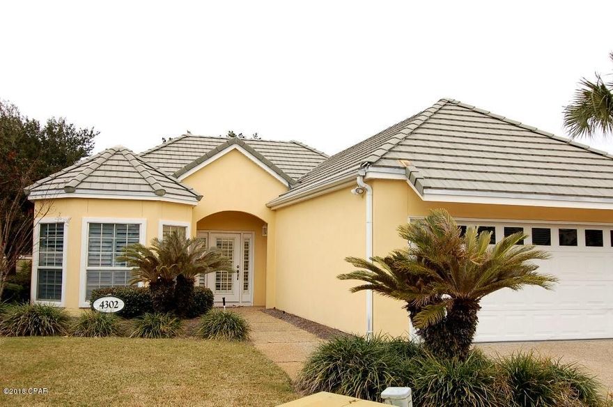 This unique home is a detached condo  in Legend Place. The association maintains the landscaping so that you don't have the yard work. This updated home has 3 bedrooms, 2 baths,and a double garage. The large enclosed patio with its view of the Jack Nicklaus Golf Course Hole 16 is heated and cooled making the home 1922 sf. Crown molding, carpet, marble and travertine flooring, gas fireplace, plantation and hurricane shutters are among the welcoming comfort of this home.  Legend PL Condo fee is $530/qtr. You need to see this home. When you buy in Bay Point, it's not just a home but a lifestyle.