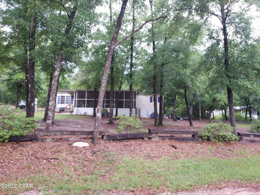 Attention buyers sellers are motivated ** You will love this place ,its quite and across from the lake. Older mobile home on 2 acres ,but its very nice and you will absolutely love this huge  18x24 screened in front porch .The yard is beautiful ,with lots of pretty  flowers, a beautiful view of the lake . This would make a great weekend place or  retirement home. Make plans to see it .