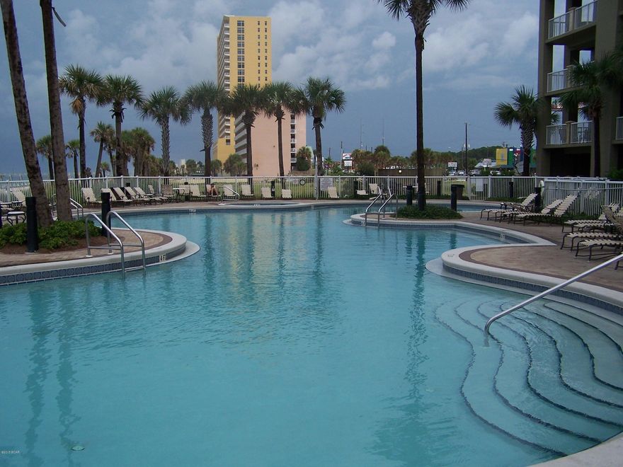Great Opportunity at Grand Panama Beach Resort! This is a highly sought after condominium complex with excellent amenities. This fully furnished incredible condo features one bedroom, sleeper sofa with a sleeping bunk alcove, dark laminate wood floors, granite counter-tops with stainless steel appliances. There are excellent views of the beach and ocean from the balcony. The amenities that are offered at Grand Panama are second to none. Fitness center, two pools, hot tubs, tiki bars, beach service and more. This unit shows true pride of ownership.