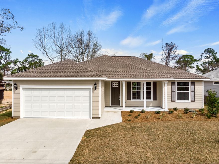 Great opportunity to purchase a beautifully constructed brand new home, centrally located in Panama City Beach, with NO HOA FEES! Located directly next door to several other new homes, this open floor plan home features 9' ceilings, stainless kitchen appliances, large kitchen island, large master bedroom with tray ceiling, double vanity master bath, large fully fenced in back yard, and a 2 car garage.  This house is on city sewage and water. This home has been constructed using quality materials throughout, including granite counter tops, hardi-board siding, tiled master shower, LVT main area and Master Bedroom flooring, enhanced insulation, 30 year shingles, along with professional landscaping(including irrigation), and to top it off this home comes with the peace of mind of a Builder's Warranty. All sizes and measurements are approximate, verify if important.