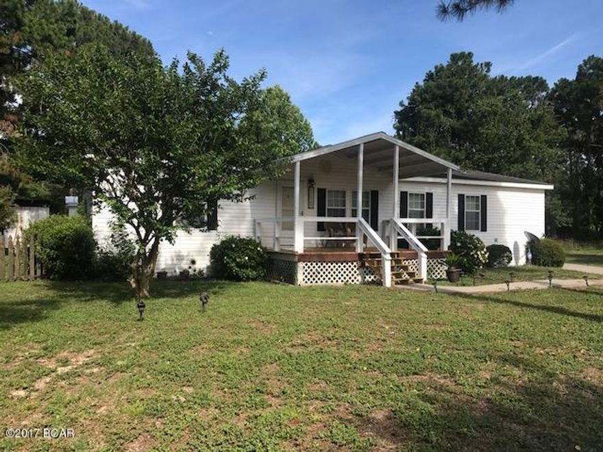 VERY NICE AND IMMACULATE MOBILE HOME. LOCATED IN A QUIET AND VERY NICE NEIGHBORHOOD. 3 BR 2 BATH MOBILE HOME WITH VERY NICE LANDSCAPED YARD. HUGE 12X28 SCREENED IN BACK PORCH. BIG WORK SHOP ATTACHED TO A 2 CAR GARAGE, ALSO A SEPARATE STEEL CONSTRUCTED UTILITY SHED. ENJOY A SPACIOUS LIVING ROOM AND KITCHEN AREA. ROOF IS APPROXIMATELY 8 YEARS OLD AMD A/C ABOUT 4.5 YEARS OLD. LAMINATE FLOORS, TILED BATHS AND OPEN FLOOR PLAN. SEPTIC LINES REPLACED ABOUT 5 YEARS AGO. COVERED SWING IN BACK YARD AND ALSO ROOF OVER THE FRONT PORCH. YARD ALSO HAS A SIDE WALK CONNECTED TO THE CEMENT DRIVEWAY.FINANCING OFFERED THROUGH 21ST MORTGAGE CORPORATION.