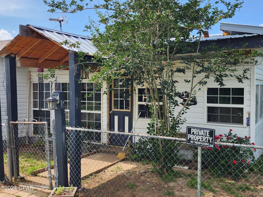 MAJOR PRICE REDUCTION!!! Welcome to the quiet Town of Alford Florida.  Whether you are looking for a primary residence or that next rental for your portfolio, look no further.  This property is convenient to Dothan, Panama City Beach and Tallahassee and minutes from I10. Situated on a completely fenced in corner lot, this 2-bedroom 1 bath home with bonus room, back porch, 1 car garage, man cave room and 12 x 12 outbuilding is waiting for your finishing touches.  New HVAC system with ductwork in 2023.  Electric water heater in 2022.  New interior doors. Updated kitchen and newer stainless appliances.  New front door and covered walkway with lighting.  Most new windows.  New vinyl siding.  Some new drywall and trim.  New insulation in attic.  House is currently on septic, but Town of Alford is running new sewer to hook up too and will be done this summer per town.  Outback you will find fruit trees and grape vines for your summer enjoyment.  Come finish with your choice of paint colors and flooring and have instant equity.  Home is priced to sell!  Call today to set up your showing Appt.  Seller would prefer 24 hr notice to show.