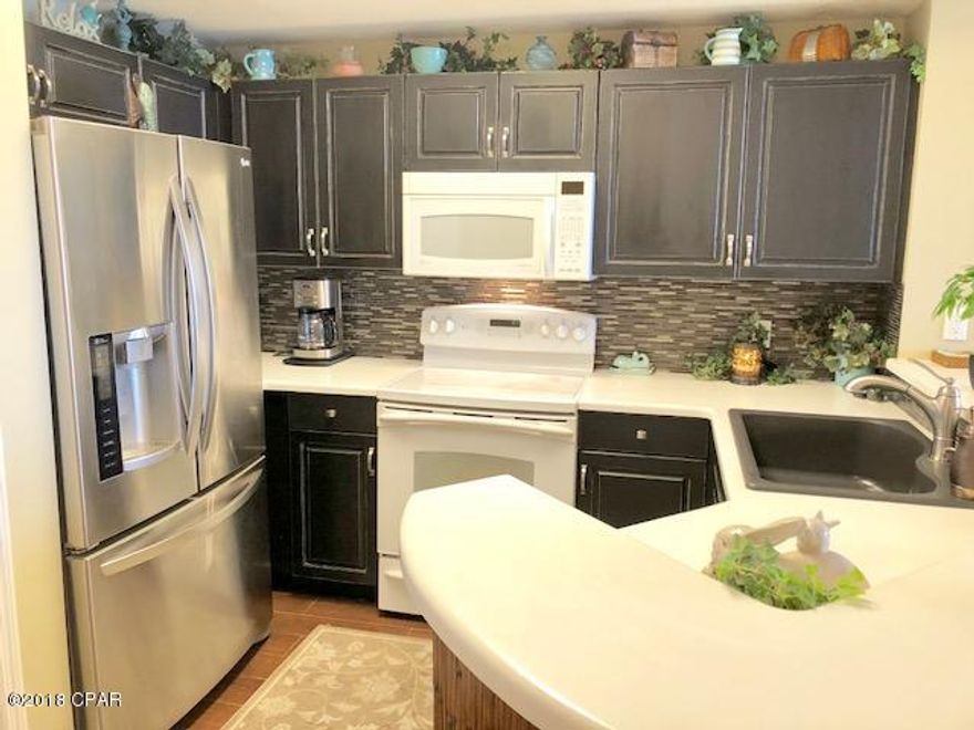 West End~Celadon Beach! Gulf Front 2 Bedroom/2 Bath with large Bunk Room in one of the most Family Friendly resorts on the beach. The private Gulf-front balcony is accessible from both living room and master bedroom. Extended tile through the living/dining areas.  Celadon Resort features include... 283' Gulf Frontage; 2 Pools with Hot Tubs, one Gulf Front; Fitness Center; Tennis Court; and Climate Controlled Walk-Over. Being sold furnished. Parking space available for an additional 25k.