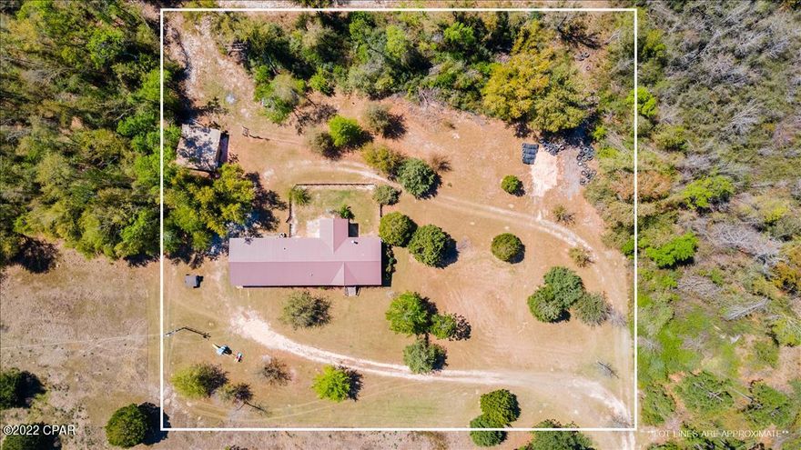Looking for peace & quiet in a country setting? This beautiful 4 bed 2 bath Zone III Deer Valley home sits on a private 3.18 acres and only a couple miles from Hwy 231 and 3.5 miles from i-10. You get the best of both worlds with this home – privacy & convenience! As you enter the front door of the home you are greeted with a large living area & fireplace. This home offers a split floor plan & the huge master bedroom is on the right side of the home. The master bath offers double vanities & a large garden tub with a separate shower. The kitchen is the perfect setting for someone who loves to cook – with a range & a wall oven you can cook simultaneously for your get togethers. With a pantry & plenty of storage, this is a wonderful space. There is an office nook right off the kitchen & the 3 additional bedrooms & bathroom are located on the left side of the home. The large laundry & mudroom leads out to the 30x30 covered carport. In the carport is a breaker box for a generator & the exterior electrical is underground. There is a 100-yard shooting range in the backyard & the yard has various fruit & berry trees. The 20x14 workshop has spray foam insulation, window a/c, & a built in work area. Attached to the workshop is a lean-to & another extended covered area. This is an amazing opportunity to have your own piece of country paradise!